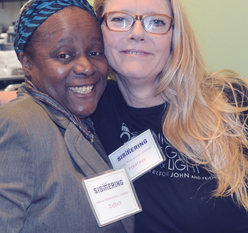 Portrait of two women working at Sistering