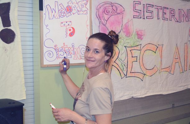 Person Writing on Board